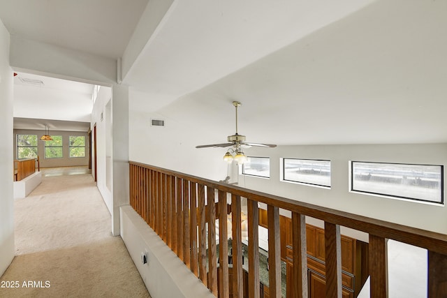 corridor with visible vents and light colored carpet