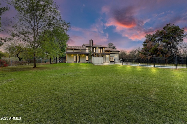 view of yard featuring a fenced in pool, a wooden deck, and fence