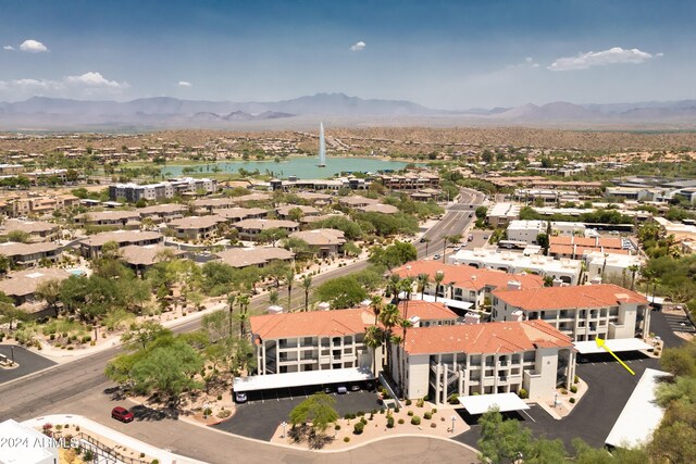 aerial view featuring a water and mountain view