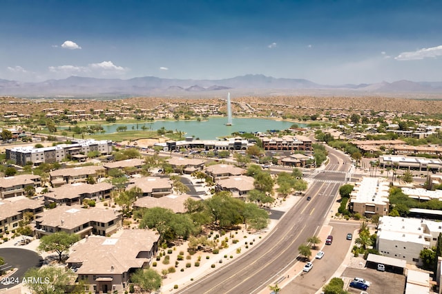 aerial view featuring a water and mountain view