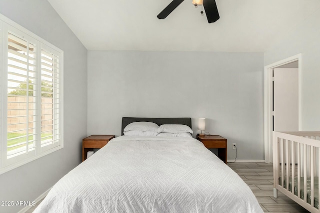 bedroom featuring wood finished floors, a ceiling fan, and baseboards