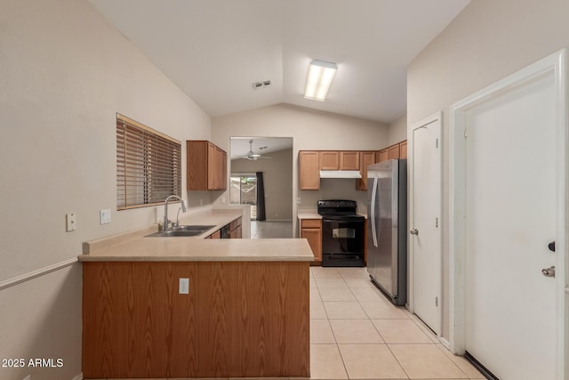 9243 W Brown St, Peoria, AZ 85345 - kitchen with black range with electric stovetop, freestanding refrigerator, a sink, lofted ceiling, and under cabinet range hood