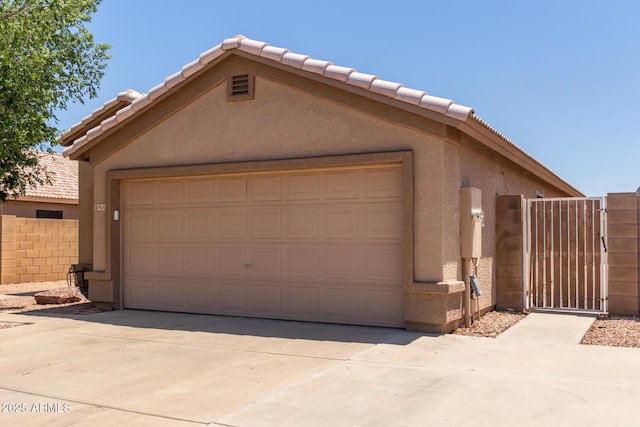 9243 W Brown St, Peoria, AZ 85345 - garage featuring a gate and concrete driveway