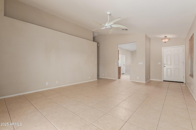 9243 W Brown St, Peoria, AZ 85345 - empty room with lofted ceiling, ceiling fan, light tile patterned floors, and baseboards