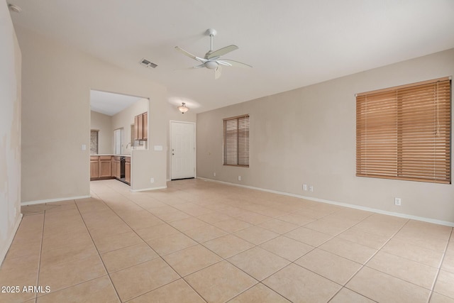 9243 W Brown St, Peoria, AZ 85345 - spare room featuring vaulted ceiling, a ceiling fan, light tile patterned floors, and baseboards
