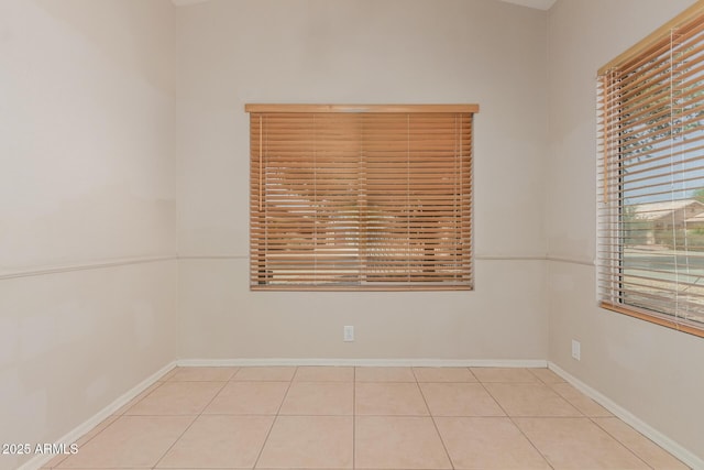 9243 W Brown St, Peoria, AZ 85345 - tiled spare room with baseboards
