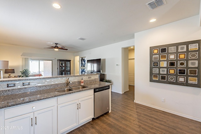 kitchen with visible vents, a sink, white cabinetry, dishwasher, and dark wood-style flooring