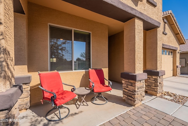 view of patio / terrace with a garage