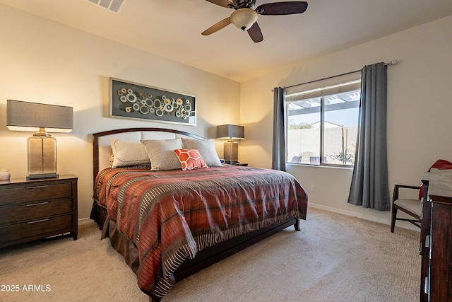 carpeted bedroom featuring visible vents, baseboards, and ceiling fan