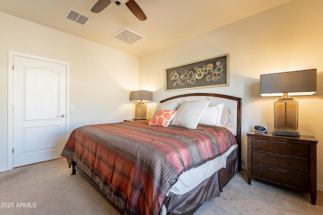 carpeted bedroom with visible vents and ceiling fan