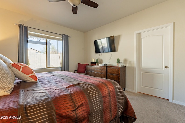 bedroom with baseboards, light carpet, and a ceiling fan