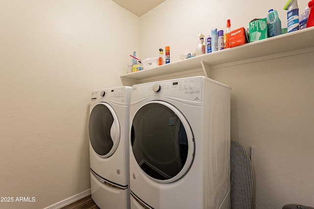 laundry room featuring laundry area, separate washer and dryer, baseboards, and dark wood-style flooring