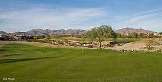 surrounding community featuring golf course view and a mountain view