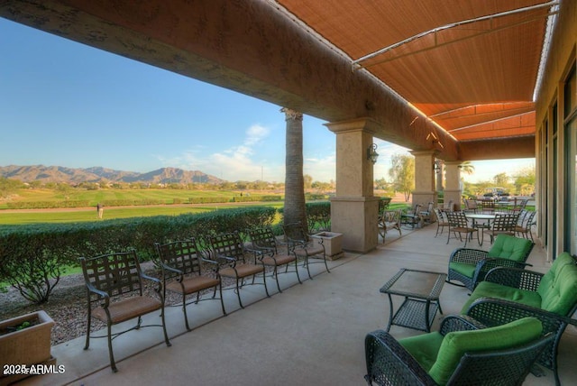 view of patio featuring a rural view and a mountain view