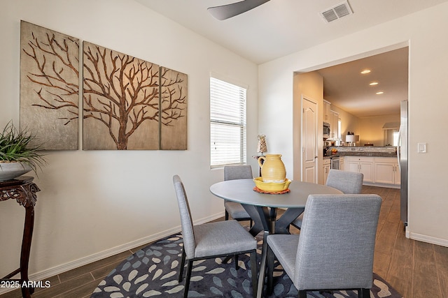 dining room featuring dark hardwood / wood-style floors and ceiling fan