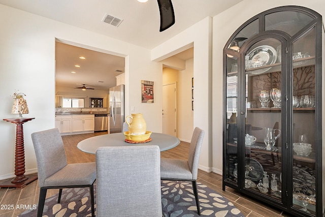 dining space featuring recessed lighting, baseboards, visible vents, and wood tiled floor