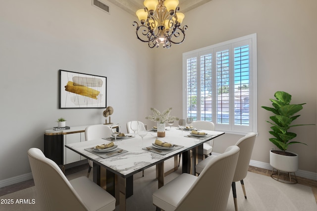 dining space with baseboards, visible vents, a wealth of natural light, and a chandelier