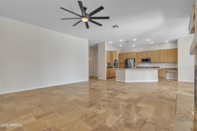 unfurnished living room with ceiling fan, stone tile floors, recessed lighting, baseboards, and visible vents