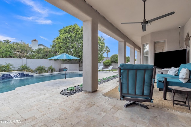 view of patio featuring a fenced in pool, a fenced backyard, and a ceiling fan