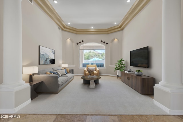 living area featuring ornate columns, baseboards, and recessed lighting