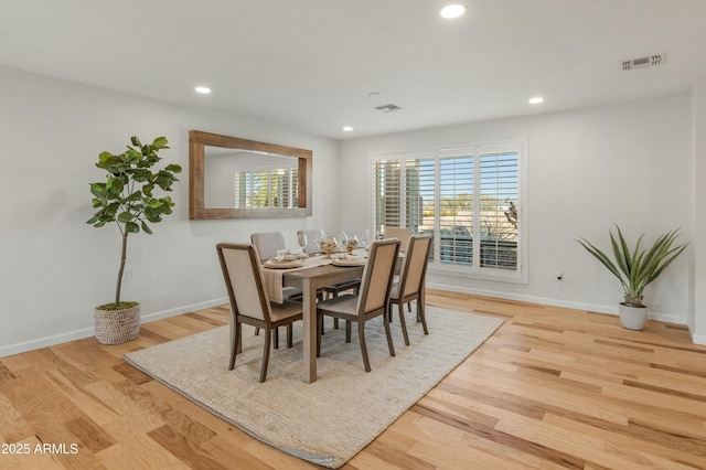 dining area with light hardwood / wood-style floors