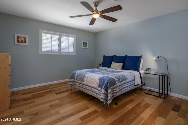 bedroom featuring ceiling fan and light hardwood / wood-style floors