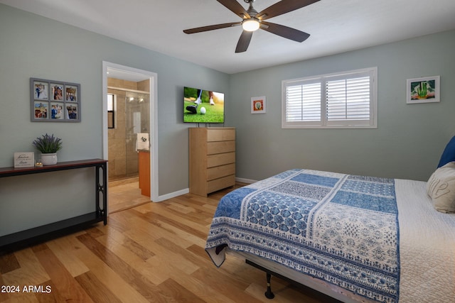 bedroom featuring ensuite bath, light wood-type flooring, and ceiling fan