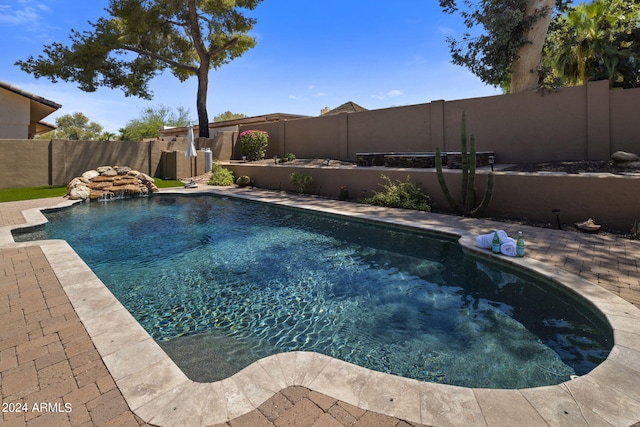 view of pool with pool water feature