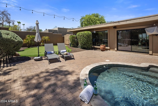 view of swimming pool with a patio