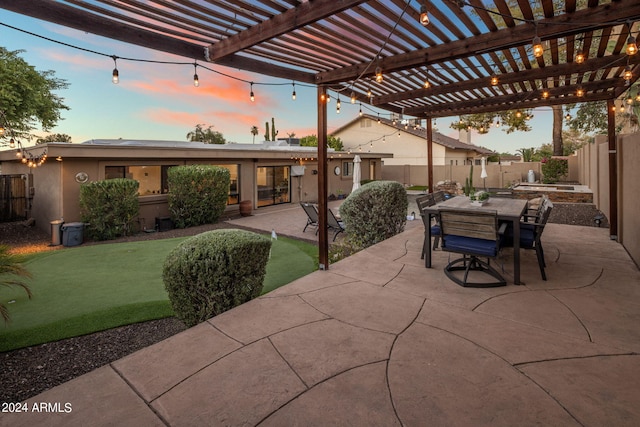 patio terrace at dusk with a pergola