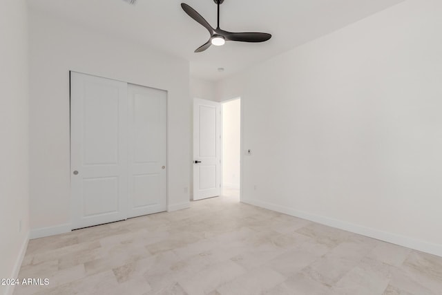 unfurnished bedroom with a closet and ceiling fan