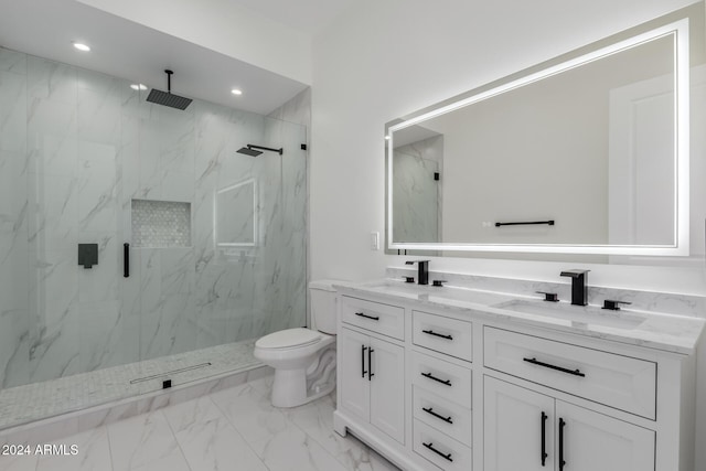 bathroom with an enclosed shower, vanity, and toilet