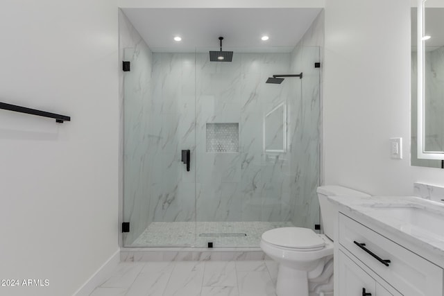 bathroom featuring vanity, toilet, and an enclosed shower