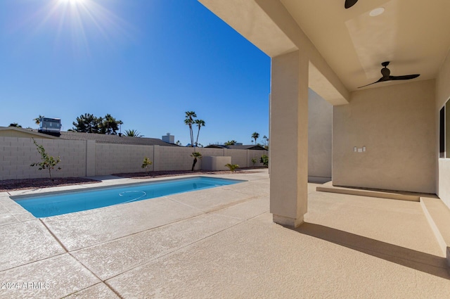 view of pool featuring ceiling fan and a patio