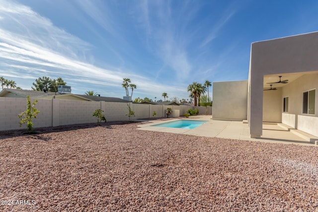 view of yard with a fenced in pool and a patio area