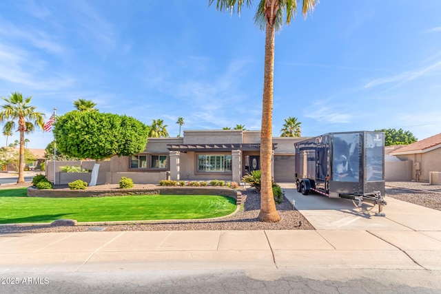 view of front of home with a garage and a front yard