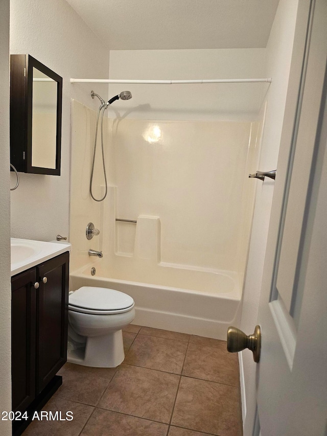full bathroom with vanity, tile flooring,  shower combination, and toilet