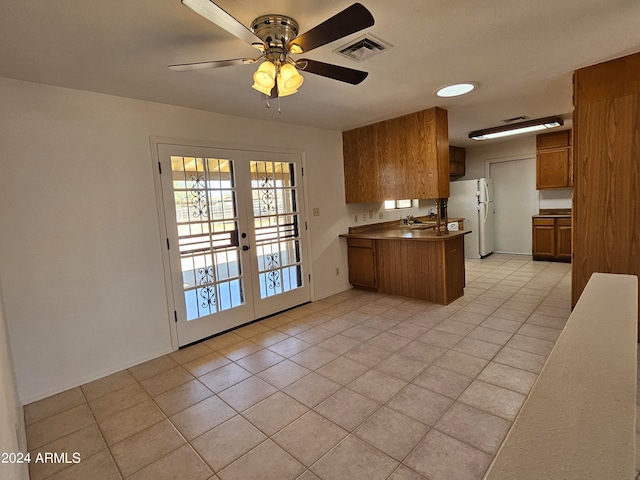 kitchen featuring french doors, sink, ceiling fan, light tile floors, and white refrigerator