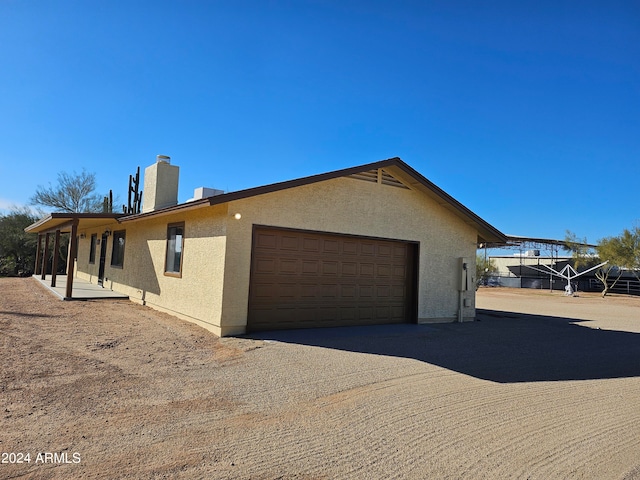 view of side of property featuring a garage