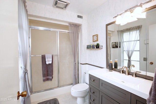 full bath with toilet, vanity, visible vents, a shower stall, and tile patterned floors