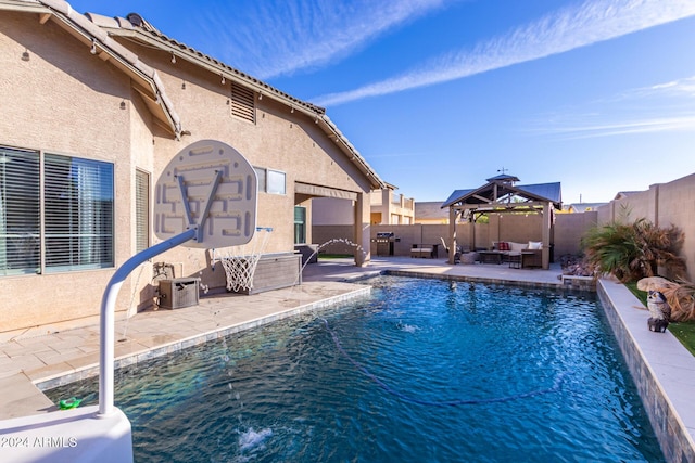 view of swimming pool featuring outdoor lounge area, a gazebo, pool water feature, and a patio