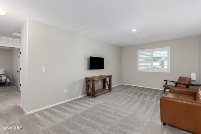 carpeted living room featuring recessed lighting, visible vents, and baseboards