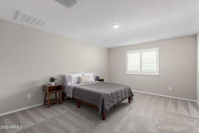 bedroom with visible vents, baseboards, and carpet floors