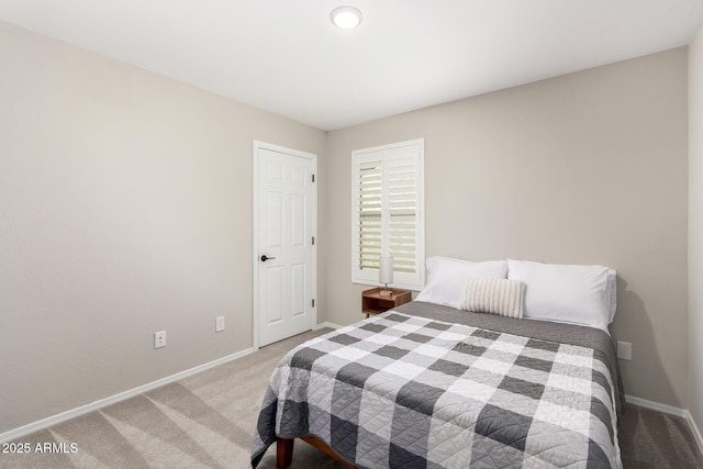 bedroom with carpet floors and baseboards