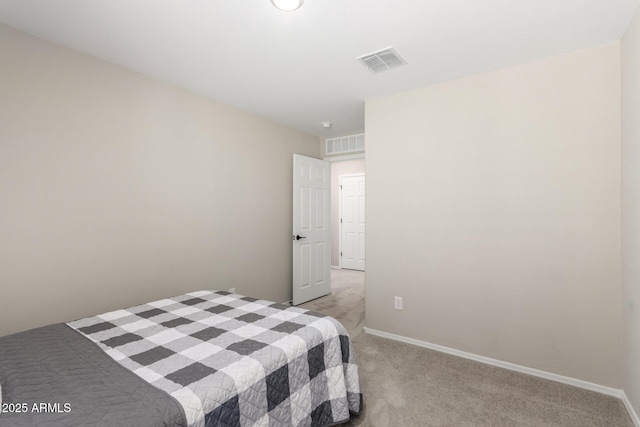 bedroom with visible vents, baseboards, and light colored carpet
