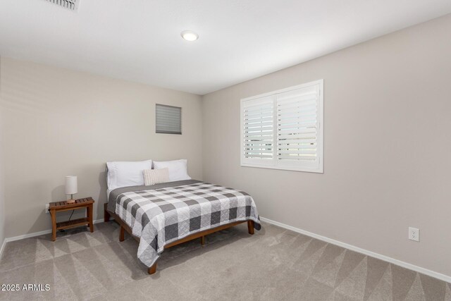 carpeted bedroom featuring baseboards