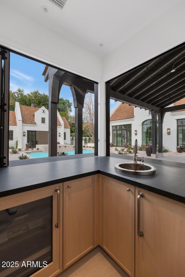 kitchen with sink and wine cooler