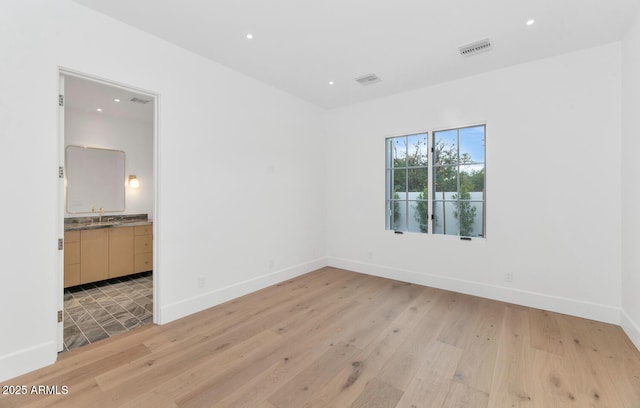 unfurnished room featuring light hardwood / wood-style flooring