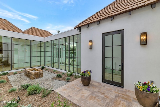 entrance to property with a patio area