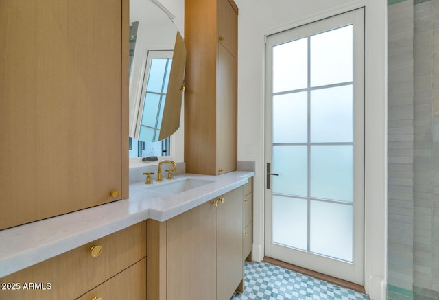 bathroom with vanity and a wealth of natural light